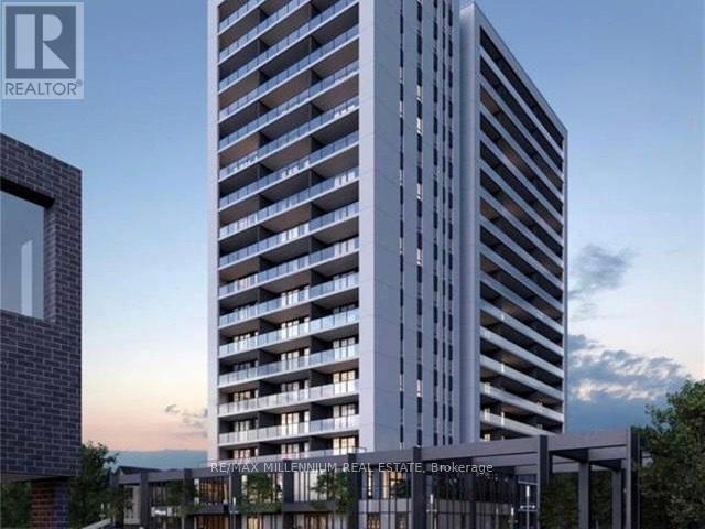 A tall building with many windows is being advertised by a realtor.