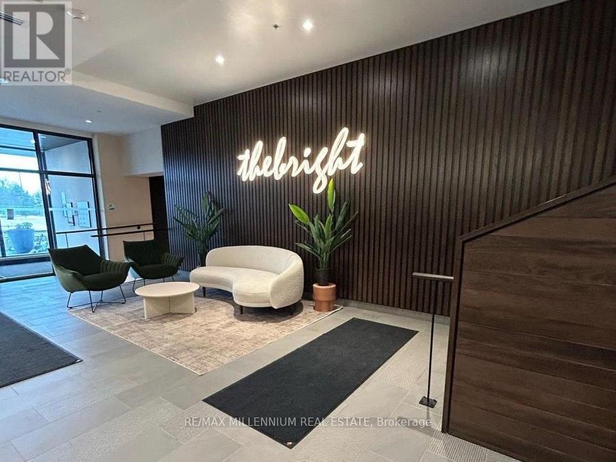 A modern waiting area with a neon sign that says "The Bright".