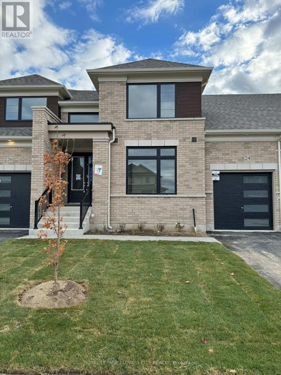 A modern house with a tree in front of it.