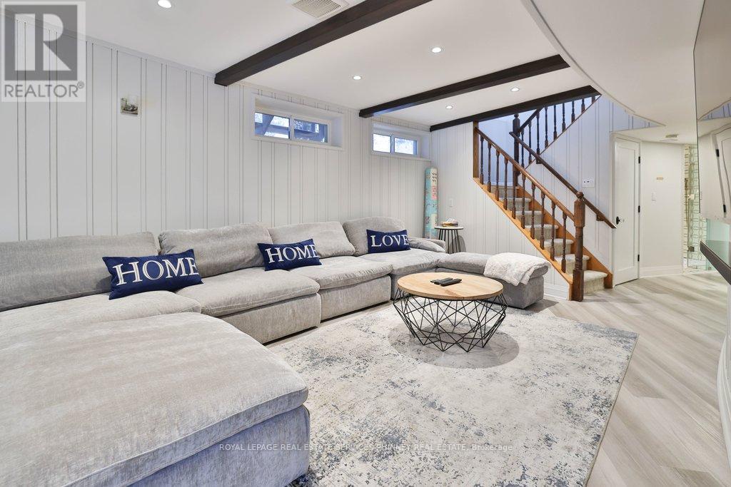 A living room with a grey sofa and a coffee table.