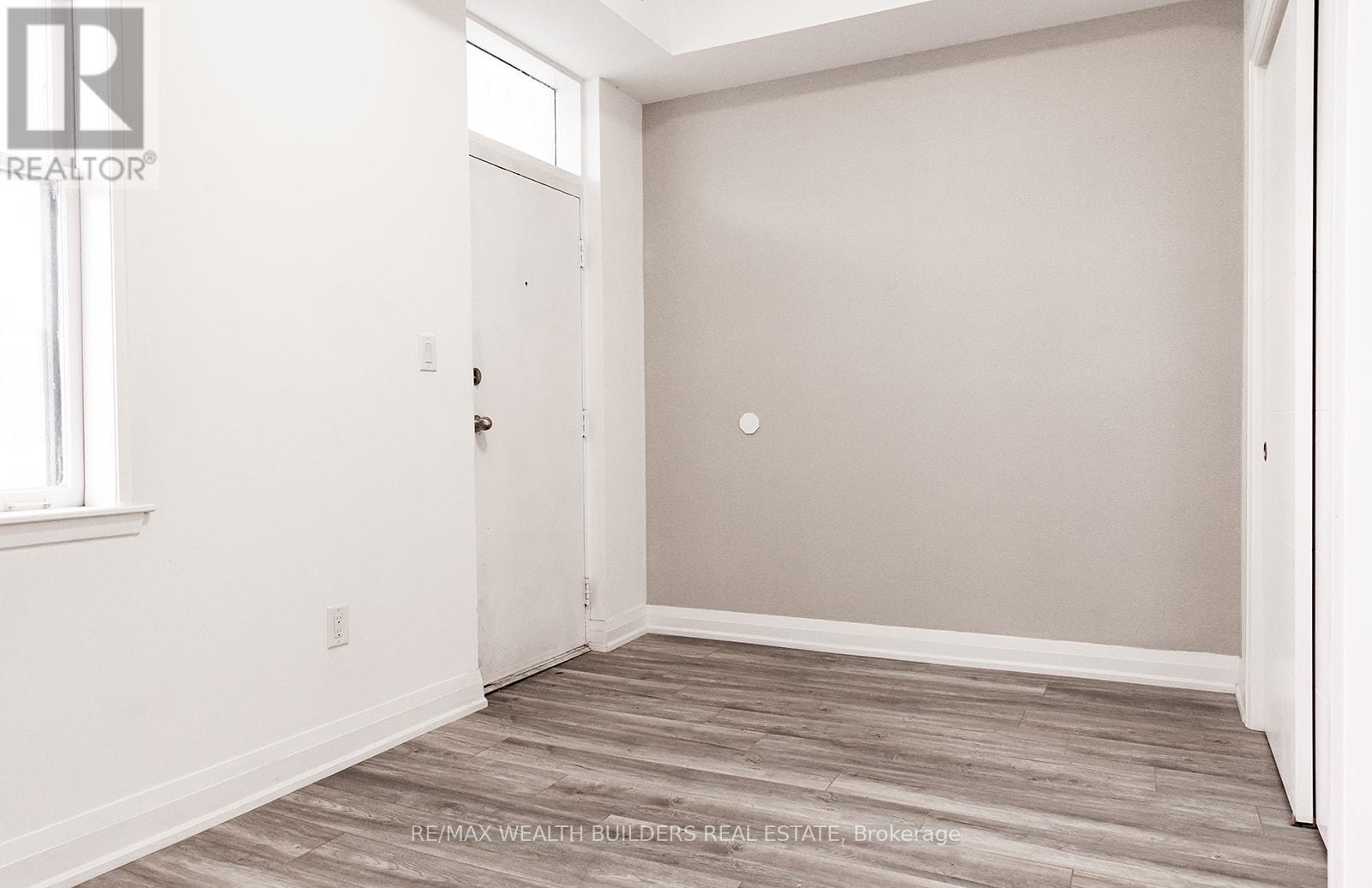 A room with a door and a window.