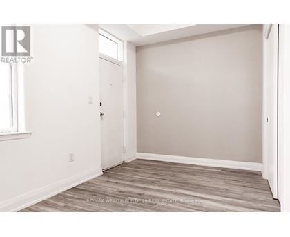 A room with a door and a window.