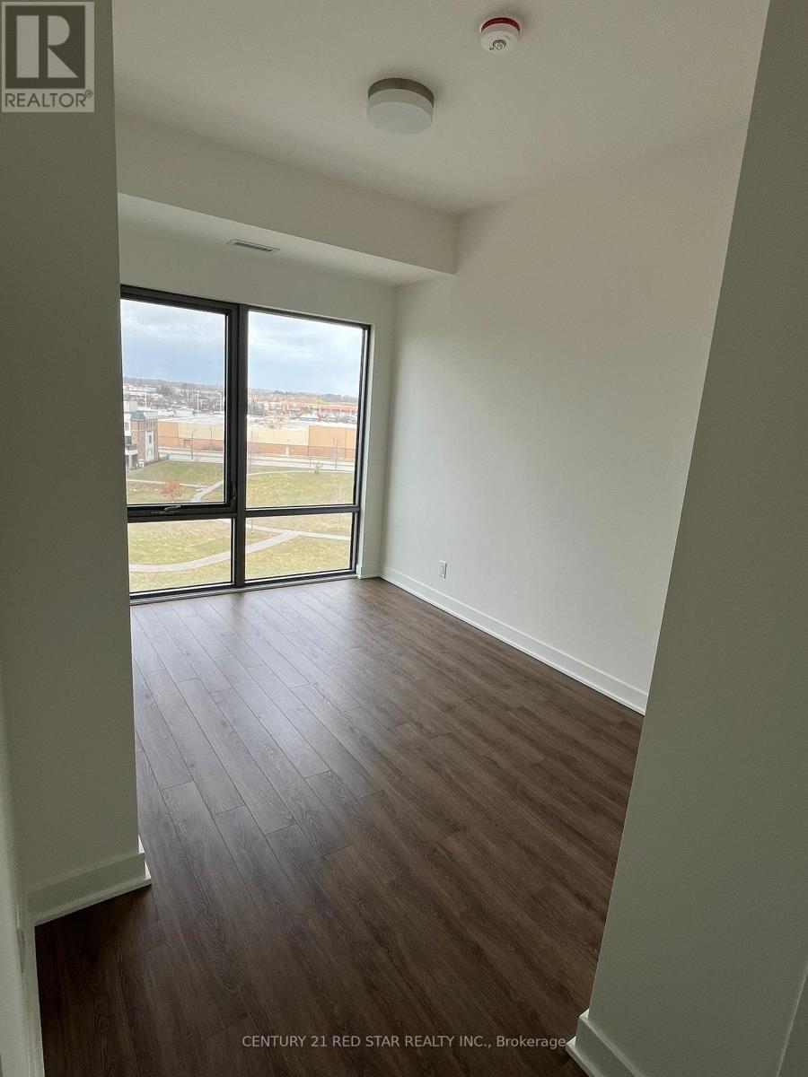 A room with a view of the outside through a large window.