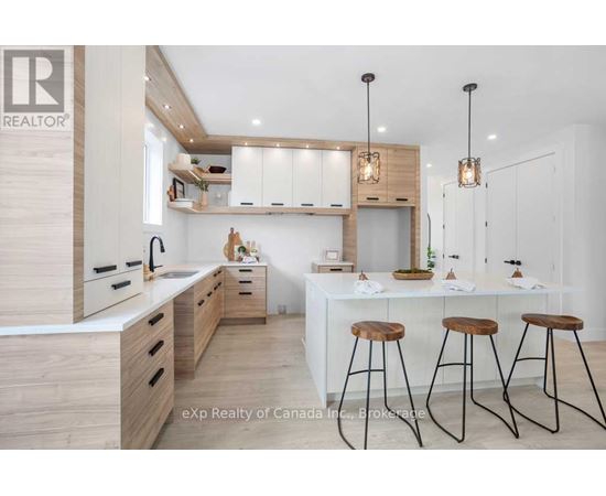 A modern kitchen with wooden cabinets and a white island.