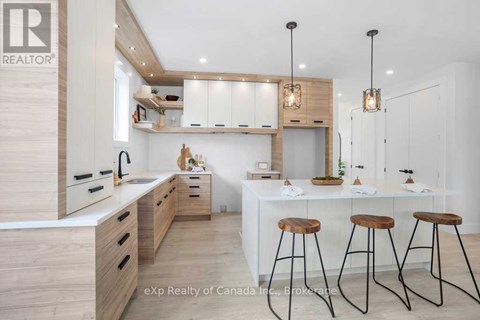 A modern kitchen with wooden cabinets and a white island.