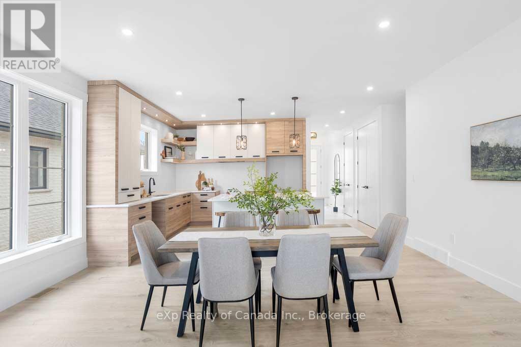 A modern dining room with a table set for four.