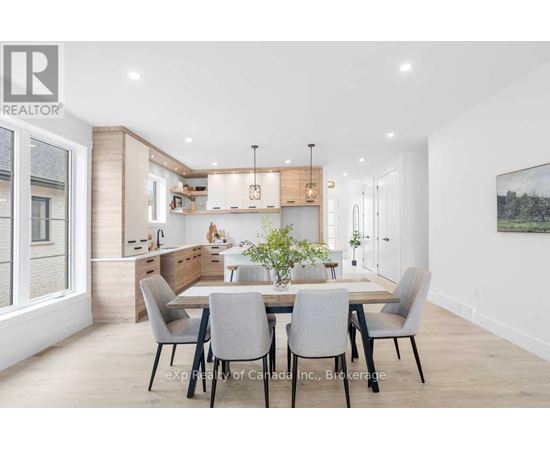 A modern dining room with a table set for four.