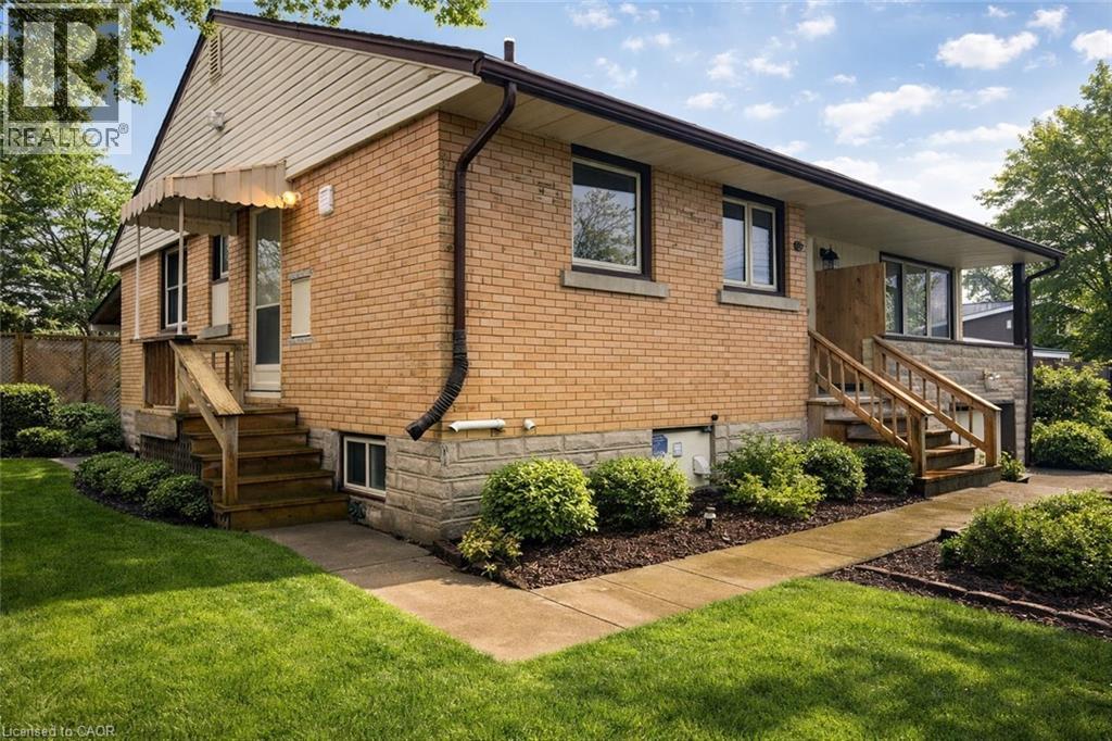 A house with a brown brick exterior and a white door.