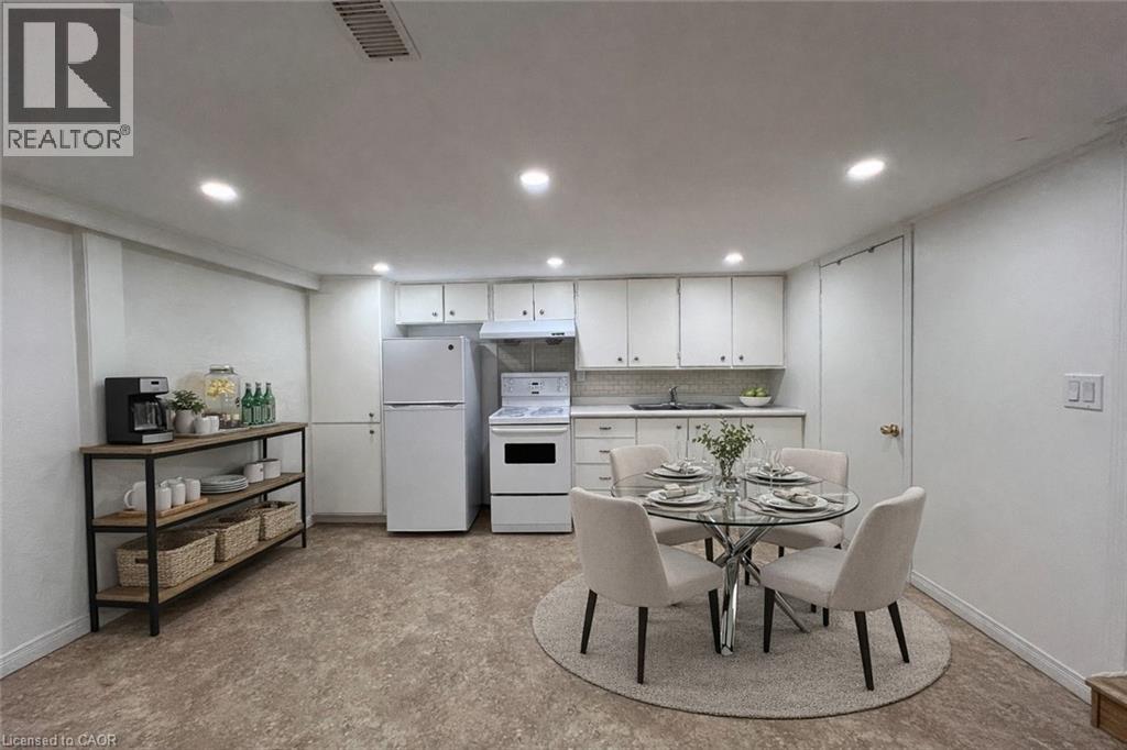 A well-lit kitchen with a dining table set for four.
