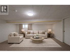 A living room with a couch, chair, and coffee table.