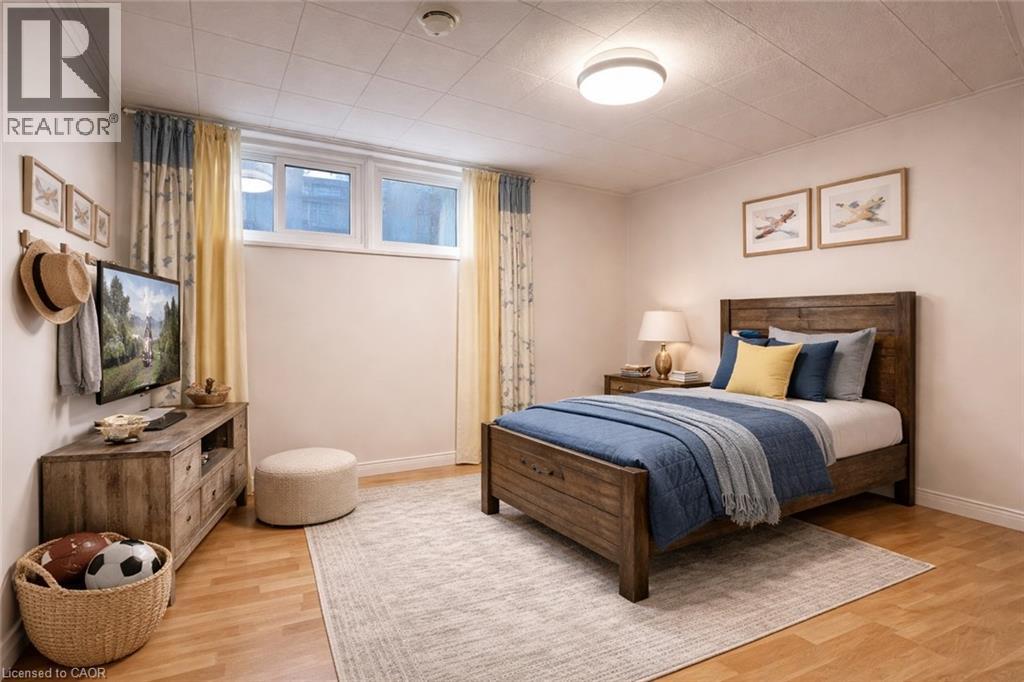 A bedroom with a bed, dresser, and window.