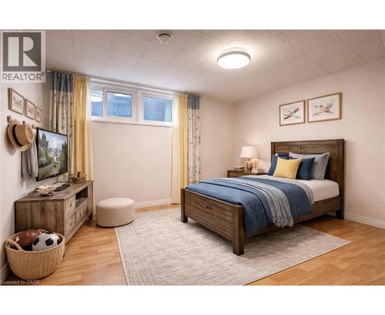 A bedroom with a bed, dresser, and window.