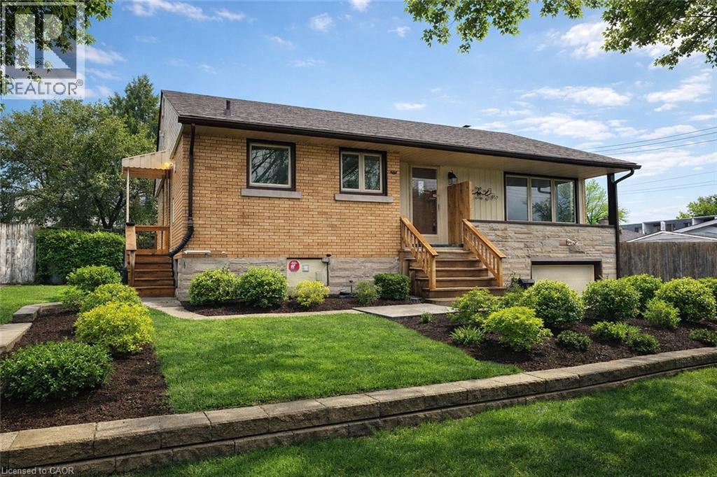 A house with a brown brick exterior and a wooden front porch.