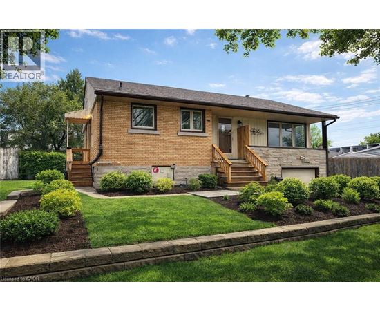 A house with a brown brick exterior and a wooden front porch.
