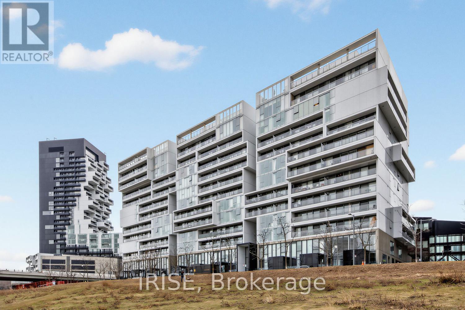 A modern multi-story building with the words "IRISE Brokerage" written on it.