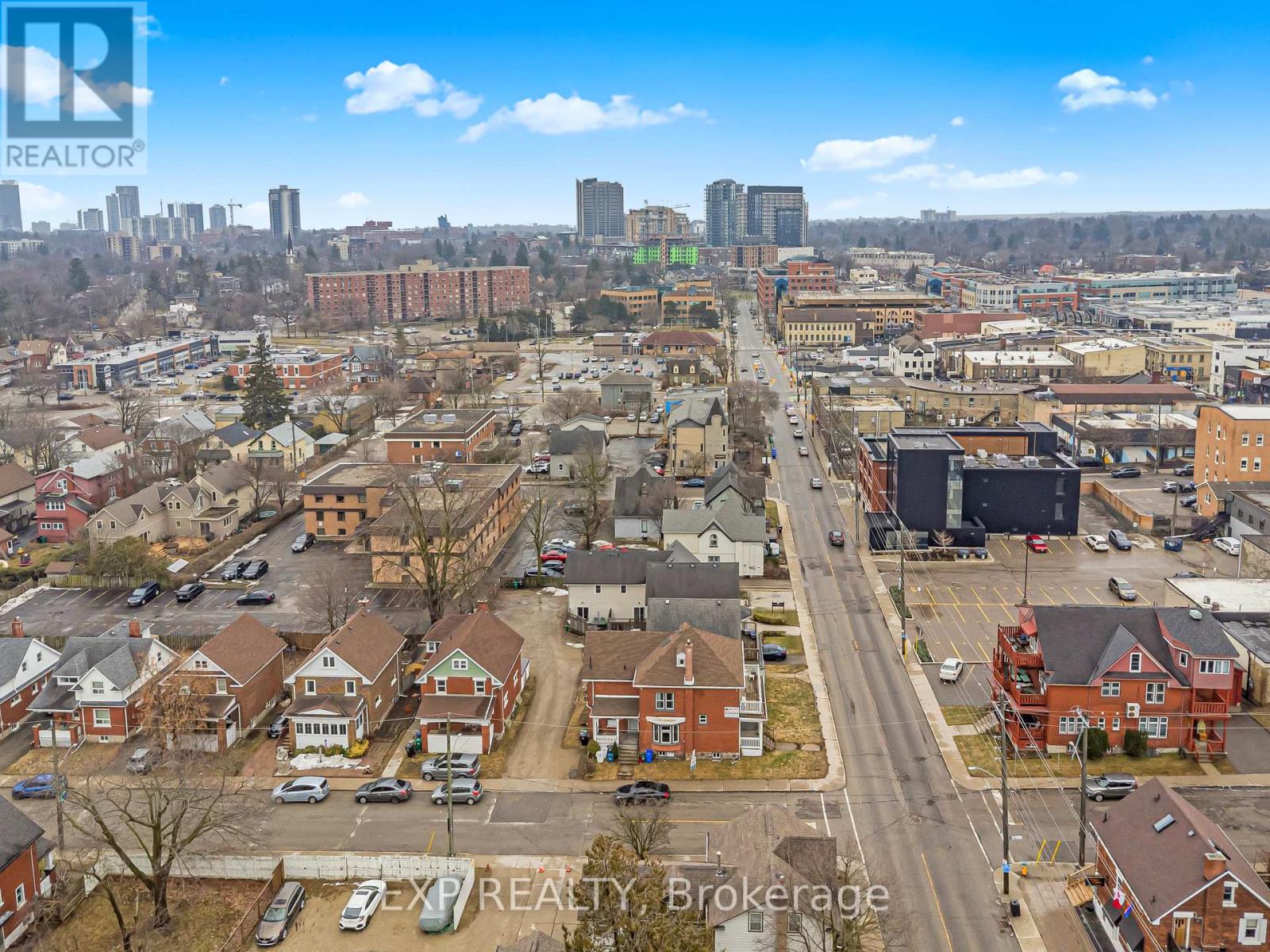 A cityscape with buildings and a clear sky.