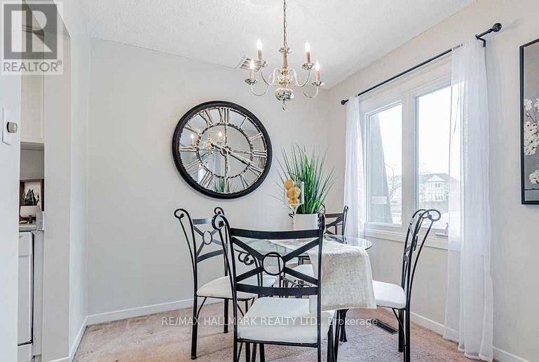 A dining room with a table set for four.