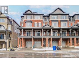 A large, multi-story residential building with a brick facade and multiple balconies.
