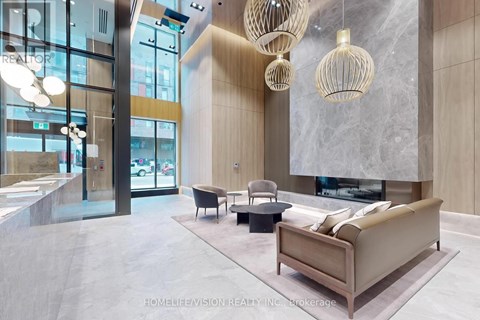 A modern living room with a large sofa and a fireplace.