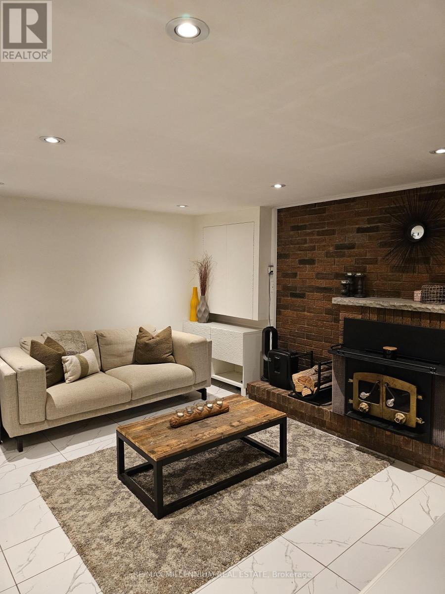 A living room with a fireplace and a couch.