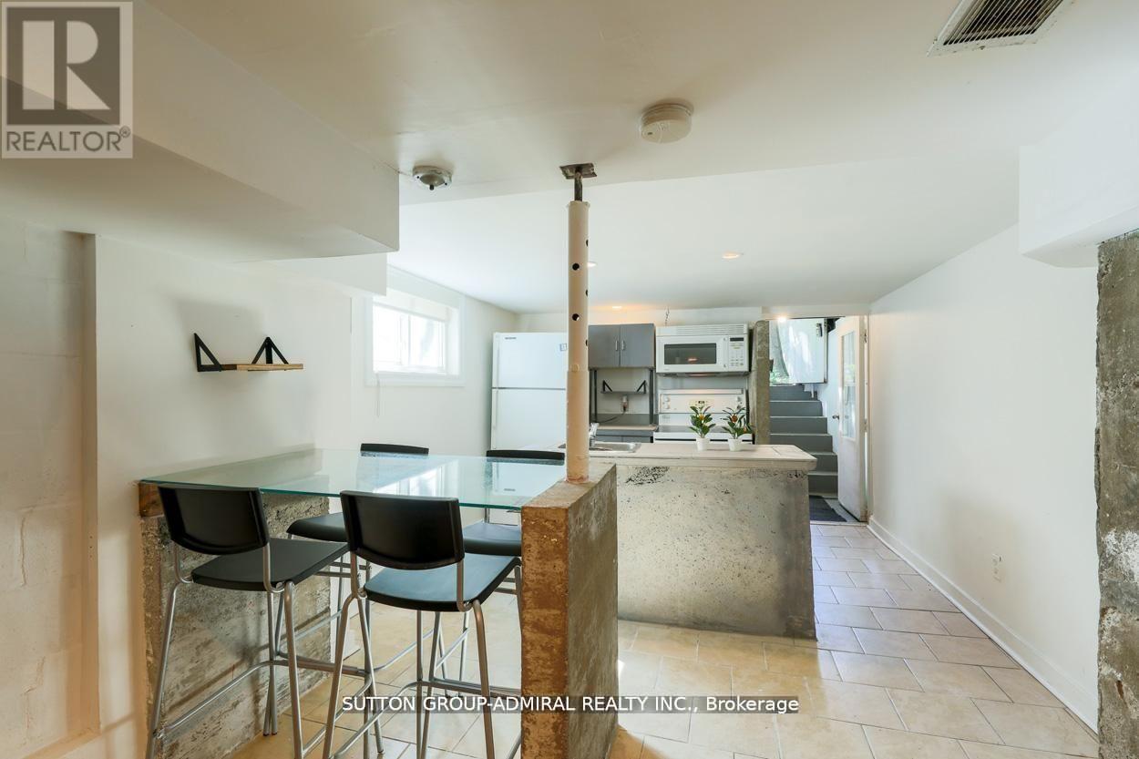 A modern kitchen with a glass table and chairs.