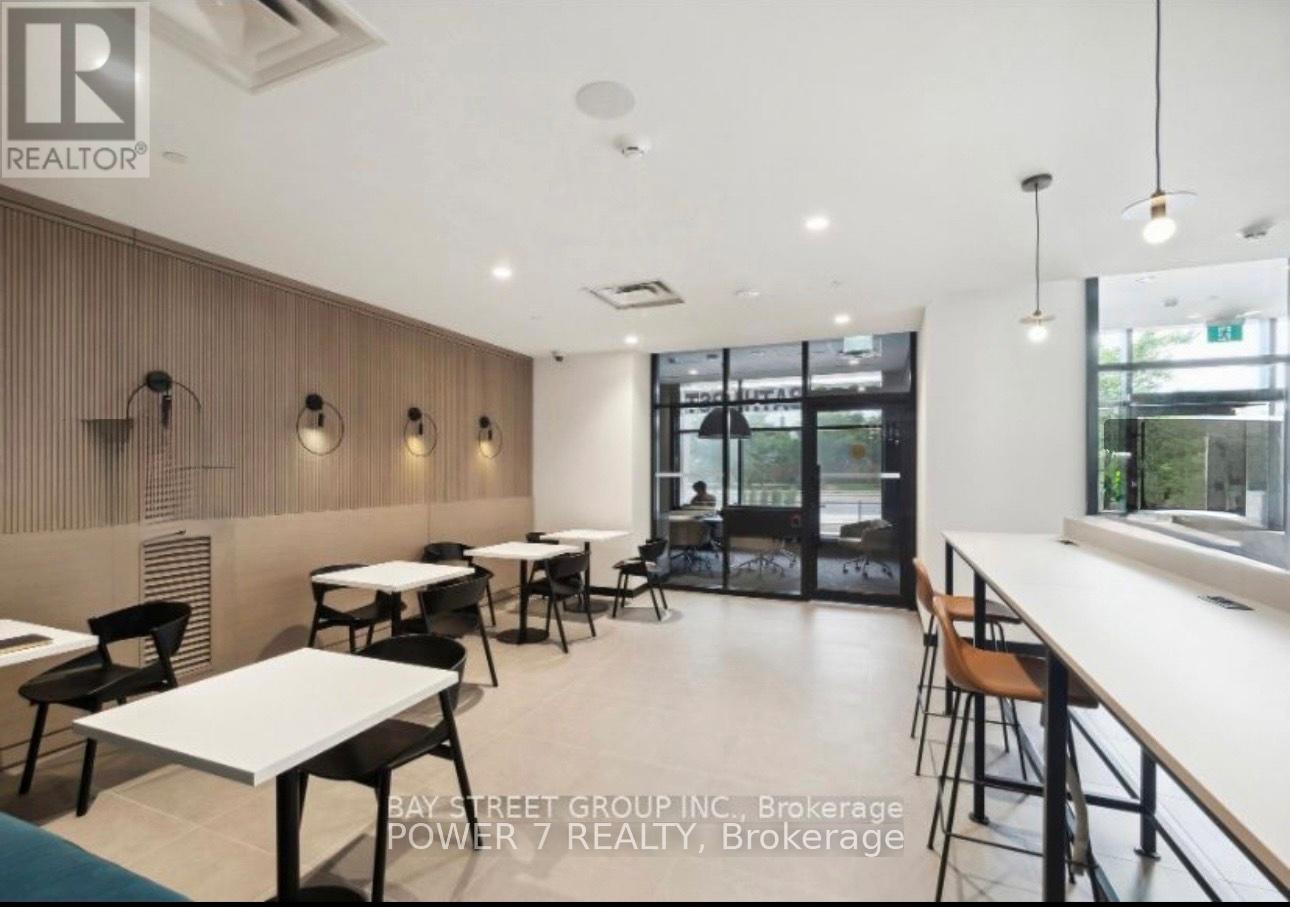A modern dining area with tables and chairs.