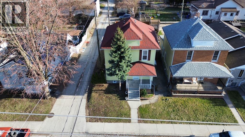 A house with a tree in front of it.