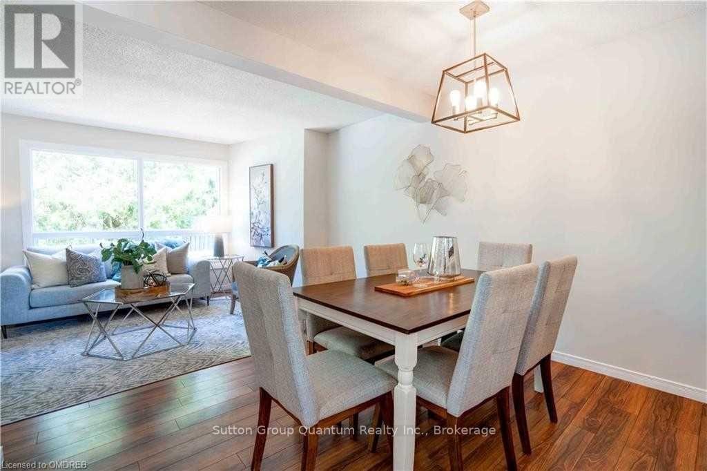 A dining room with a table set for six.