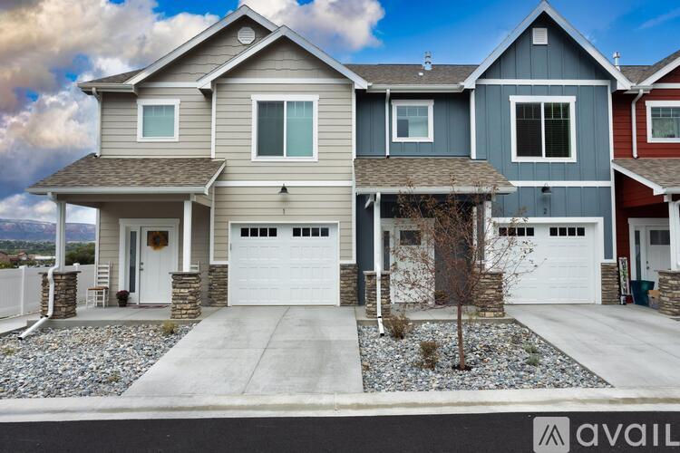 A house with a garage is available for sale.