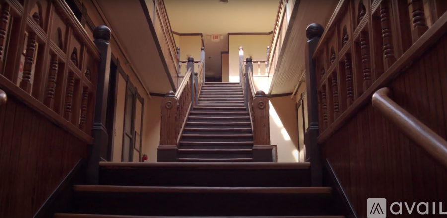 A staircase with wooden balusters and handrails.