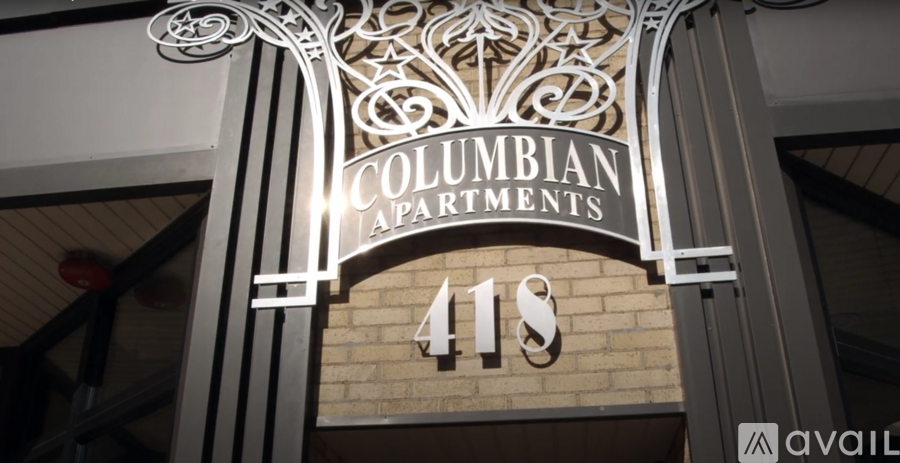 A sign for Columbian Apartments is displayed above the entrance.
