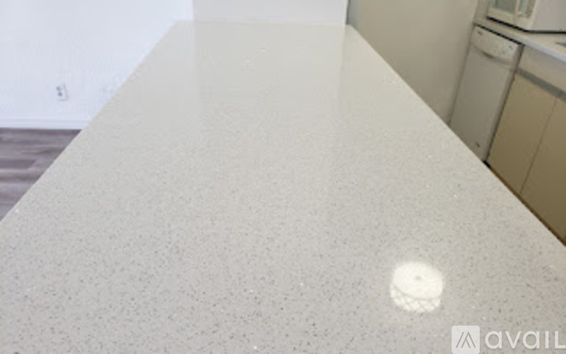 A white counter top with a hole in the middle.