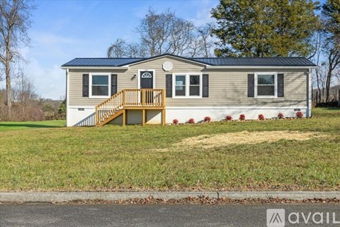 A house with a porch and a balcony is available for rent.