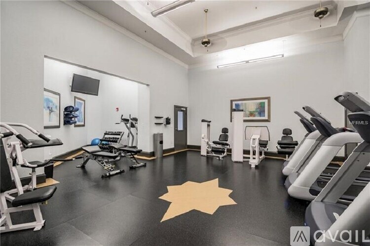 A gym with a star on the floor.