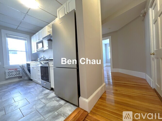 A kitchen with a refrigerator that says Ben Chau.