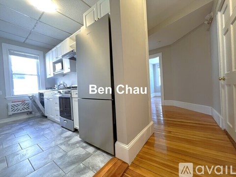 A kitchen with a refrigerator that says Ben Chau.