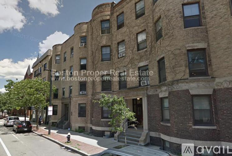 A street view of a building with the text "Foston Proper Real Estate" on it.