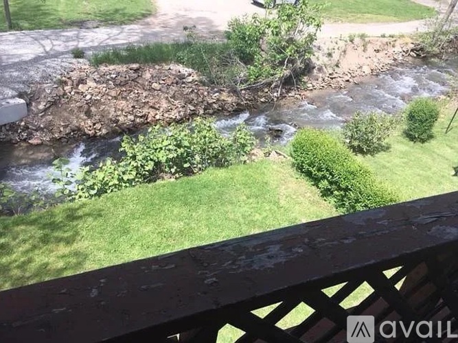 A river flows through a green landscape.
