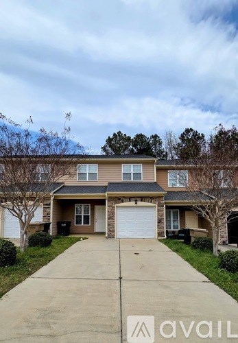 A house with a driveway in front of it.