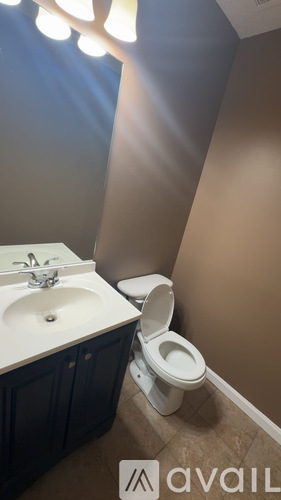 A bathroom with a toilet and sink.