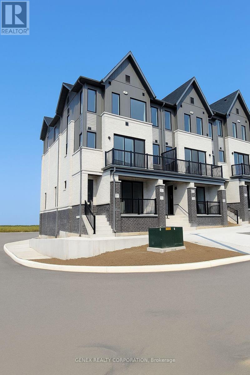 A modern two-story house with a balcony on the second floor.