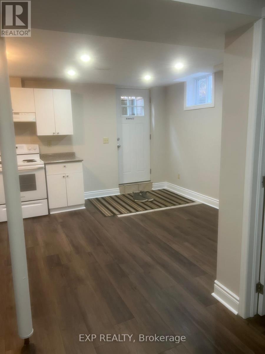 A room with wooden floors and white walls.