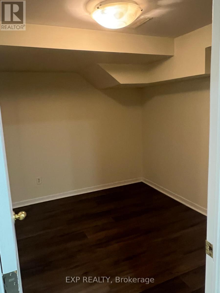A room with EXP REALTY, Brokerage written on the floor.