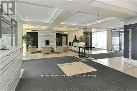 A spacious lobby with a black and white checkered floor.
