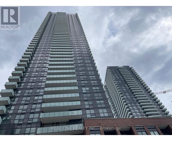 A tall building with the words "REAL ONE REALTY INC Brokerage" on the side.