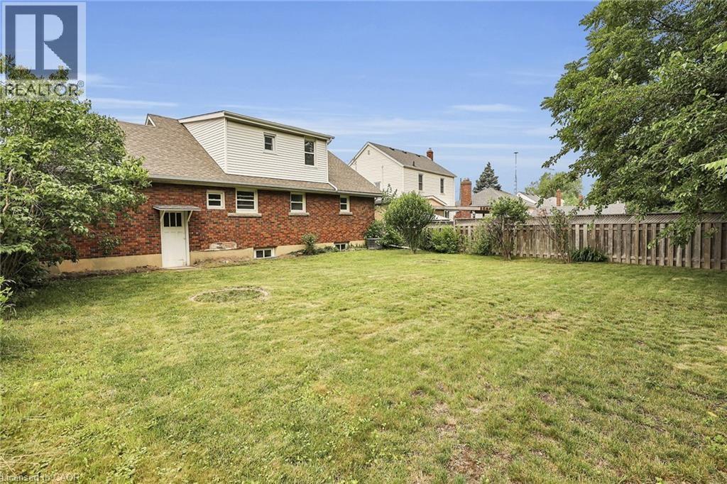 A house with a yard in front of it.