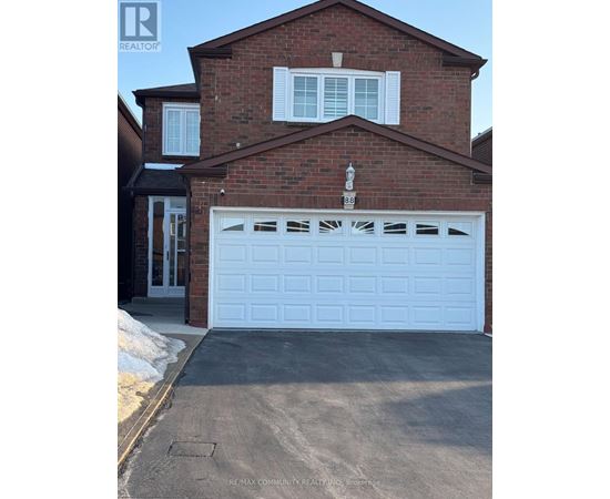 A house with a white garage door is for sale.