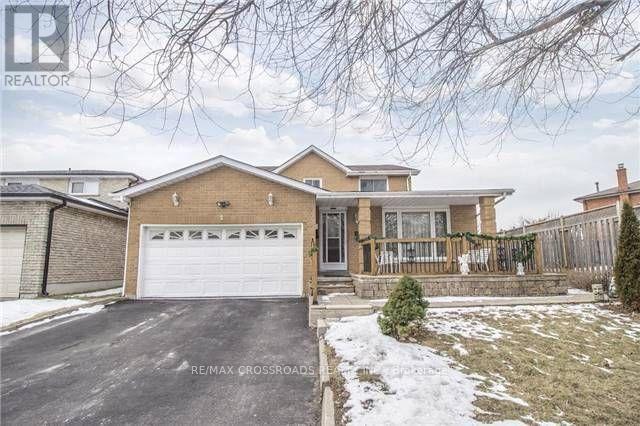 A house with a garage is for sale.