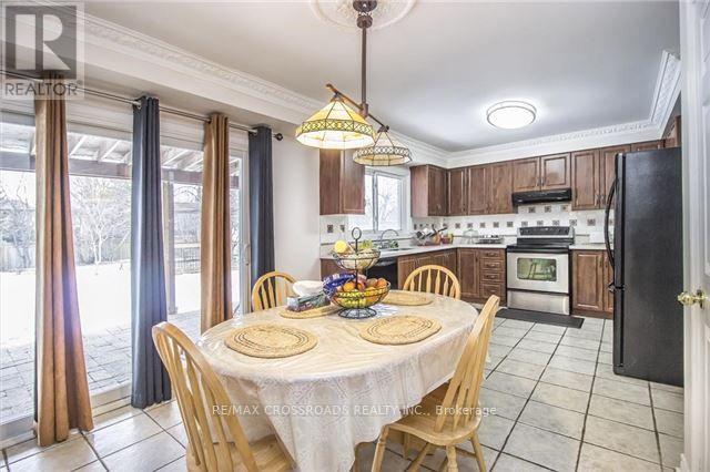 A dining room with a table set for a meal.