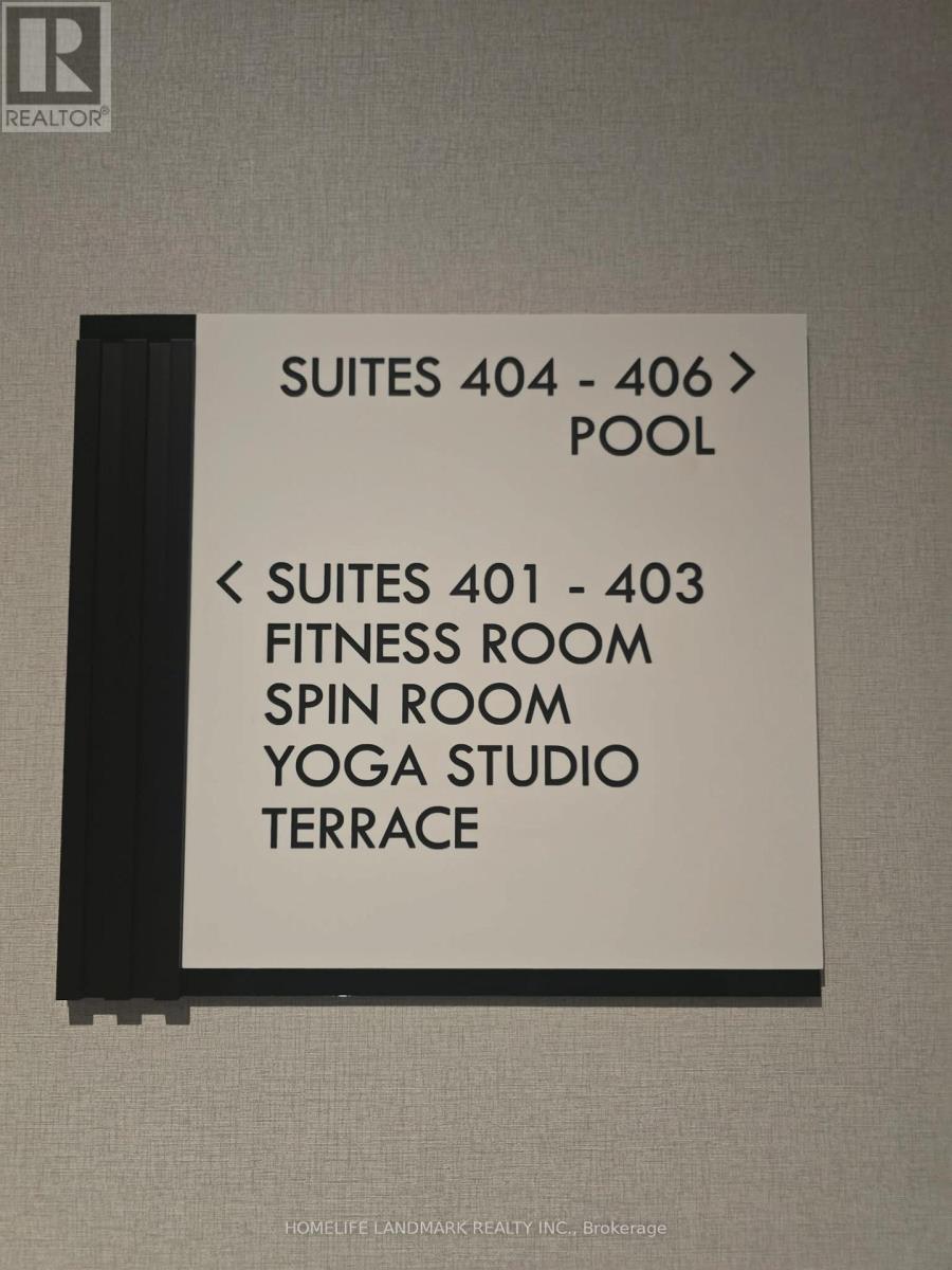 A sign indicating the location of the pool and fitness room.